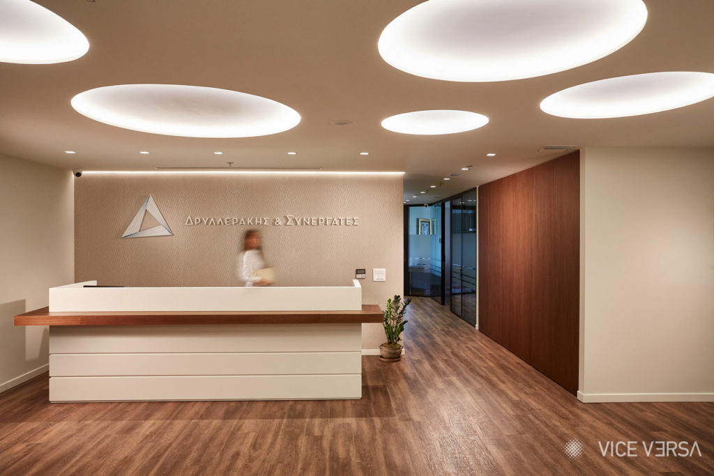 Dryllerakis Law Firm reception with a blurred figure in the background