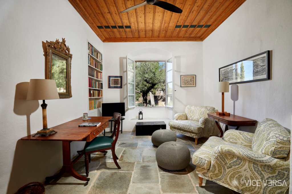 Lounge interior with olive trees at Patrick and Joan Leigh Fermor House
