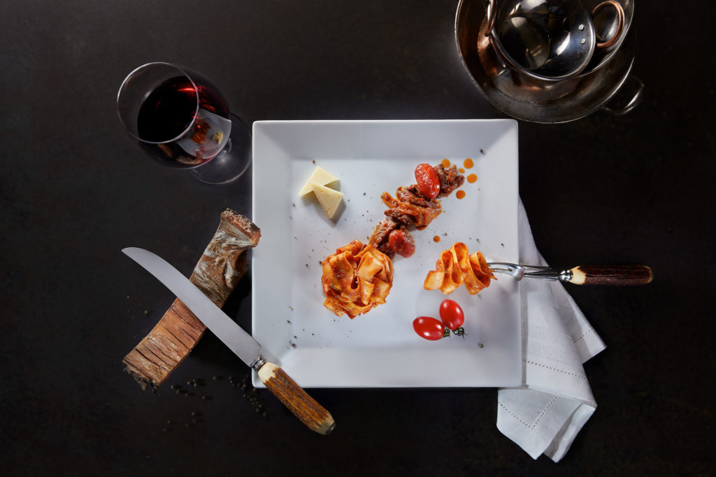 Top-view pappardelle with ragù styled for Telemachos Athens