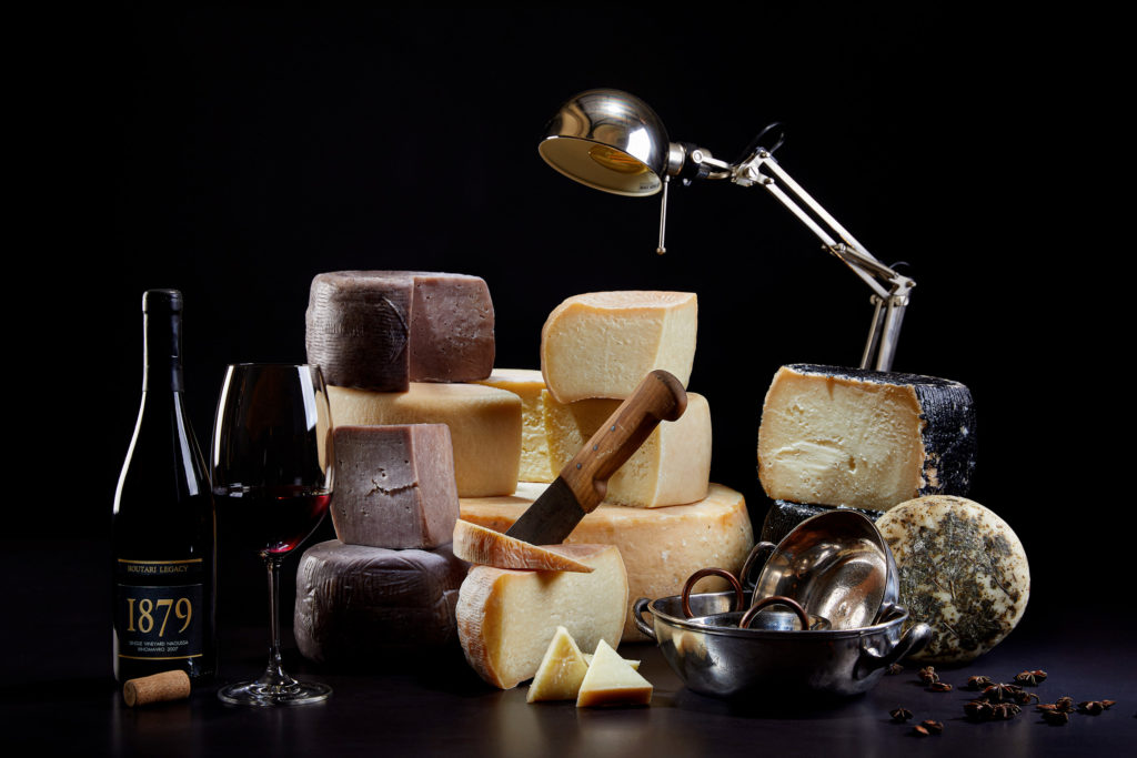 Cheese and wine composition with vintage tabletop styling