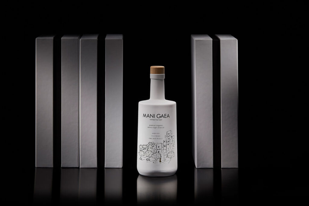 Mani Gaea olive oil bottle with geometric black and white packaging
