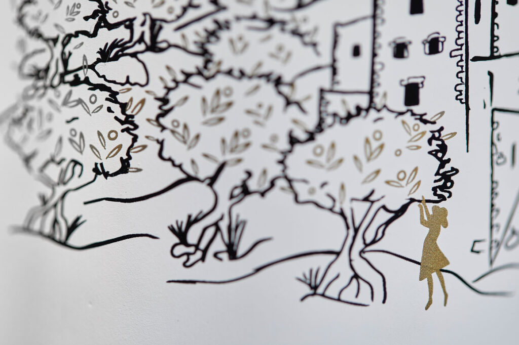 Close-up of engraved detail on Mani Gaea olive oil bottle