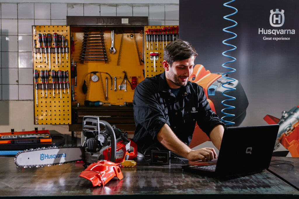 Papadopoulos SA employee working at computer beside professional tools