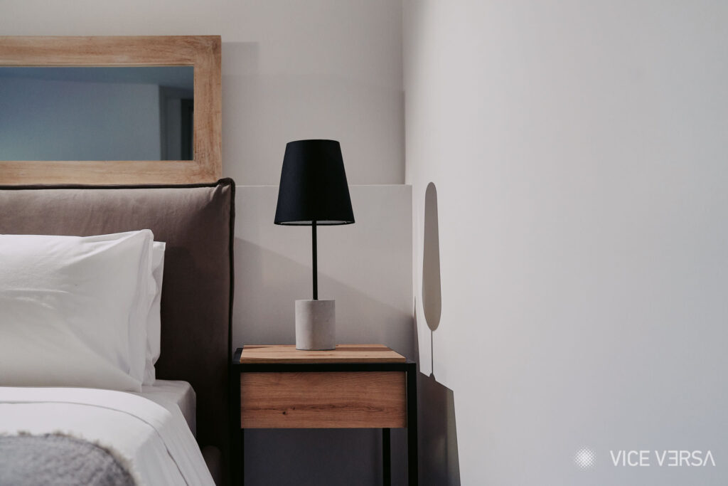 Bedroom with bedside table and lighting at Marigold Residences Athens