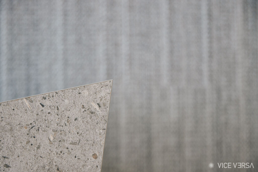 Angular stone surface detail against a textured backdrop in the OAKA Presidential Suite