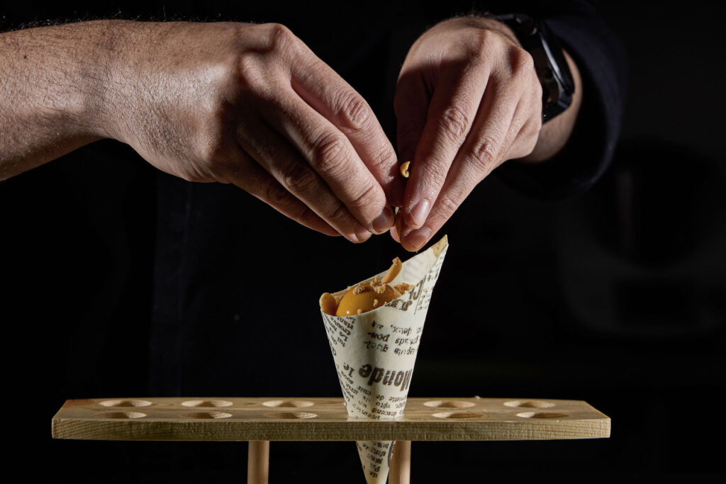 Close-up of Peanuts on the Go pastry being filled with peanuts