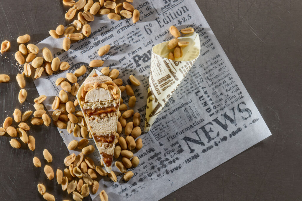 Cut pastry cones revealing the layered Peanuts on the Go dessert