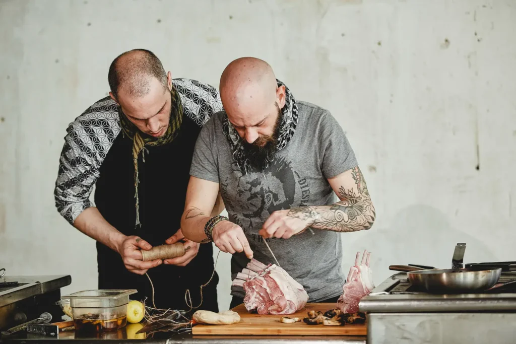 Chefs hands on photo preparing meat for roasting
