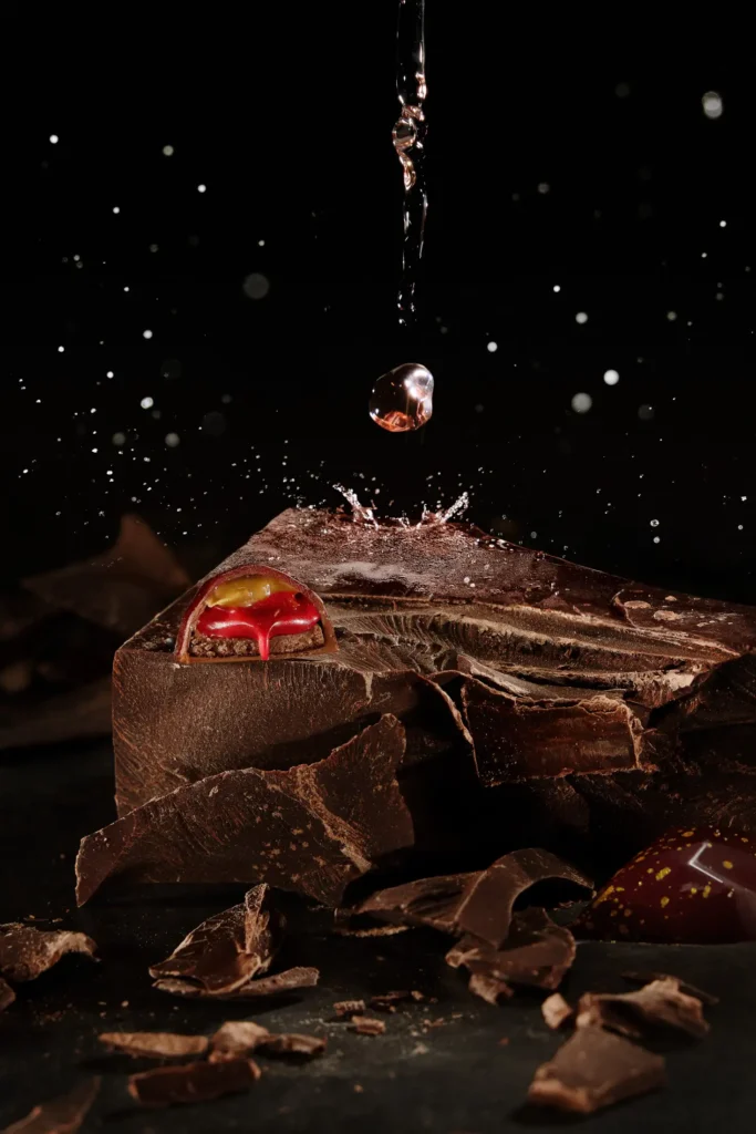 High-speed photograph for Callebaut's global campaign with a champagne splash behind a bonbon
