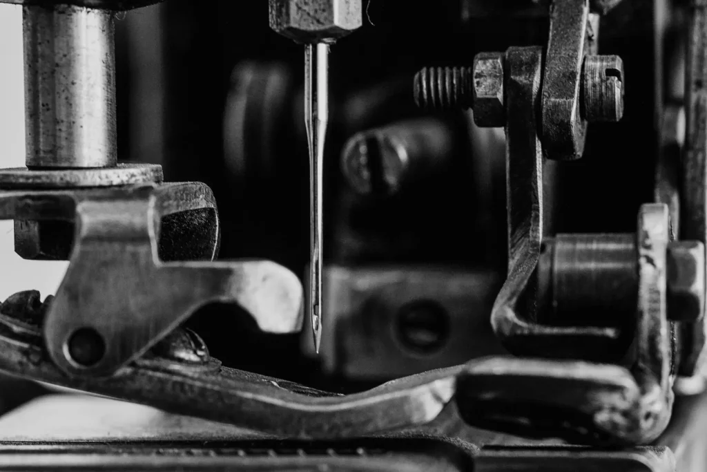 Black-and-white detail of vintage sewing machine