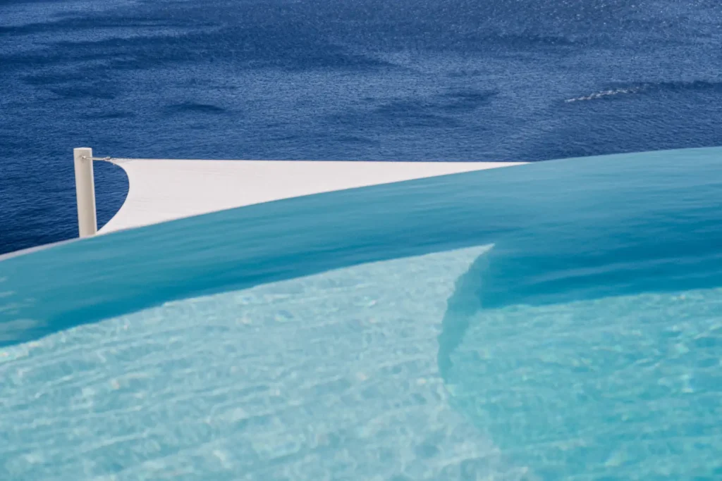 Mystique hotel pool overlooking the Santorini Caldera