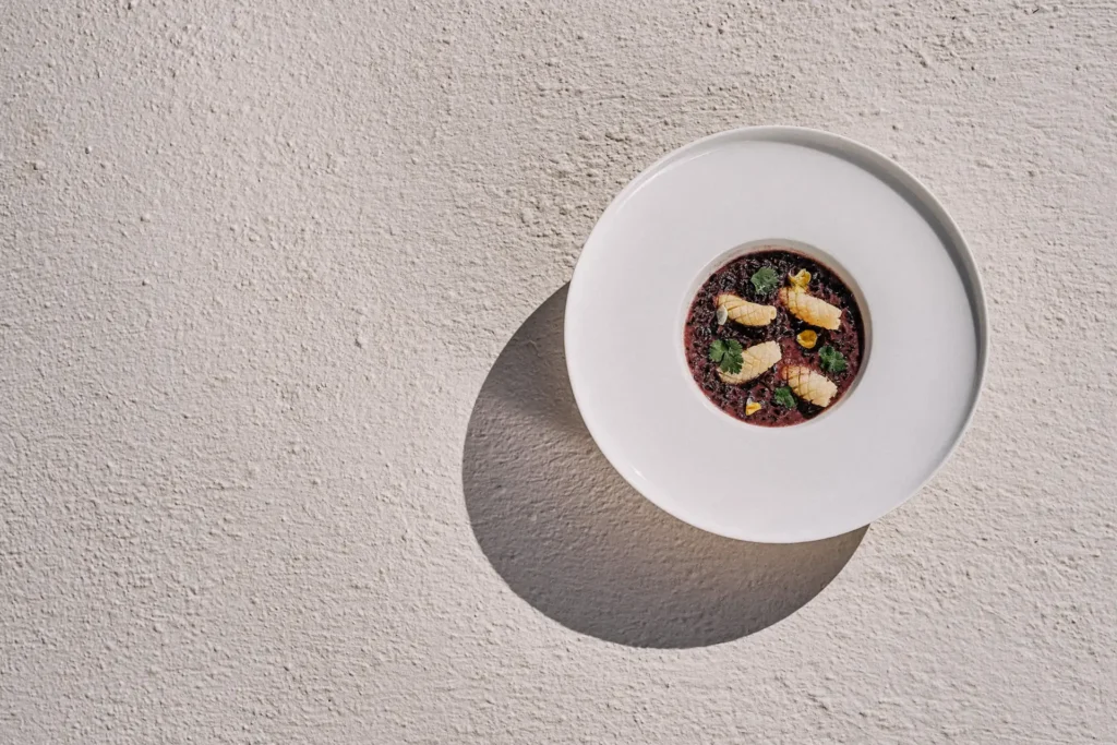 Top-view lunch plating in natural light with Cycladic textures