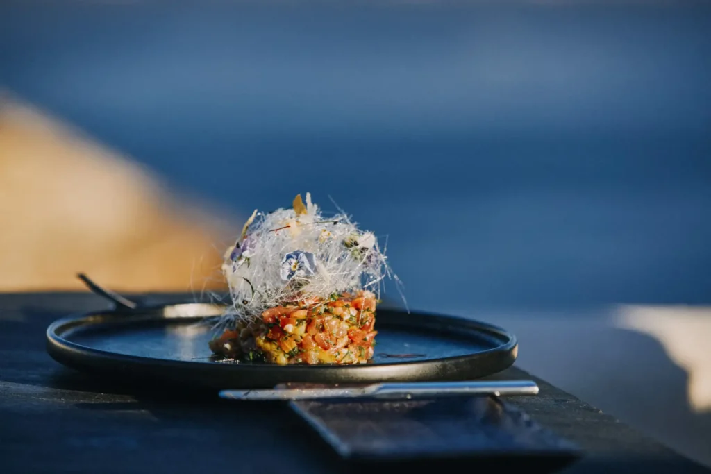 Creative tartare dish with Aegean Sea view in Santorini