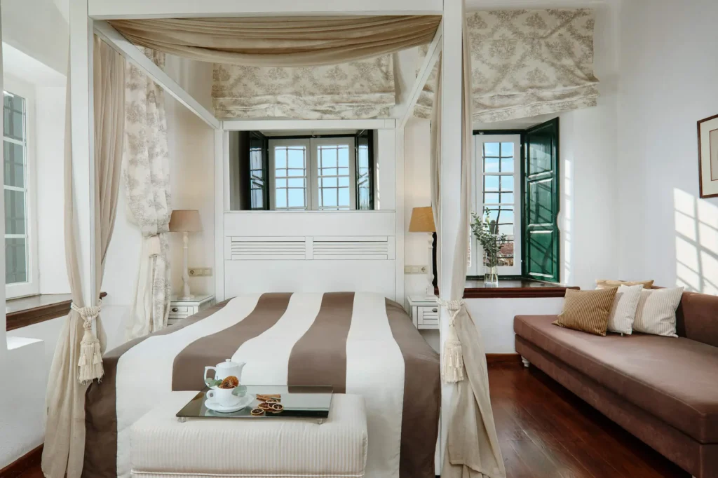 Styled guest room inside the historic mansion at Despotiko