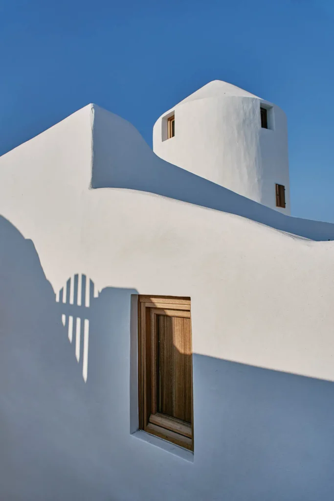 Exterior architecture of The Mill Haven windmill in Oia Santorini