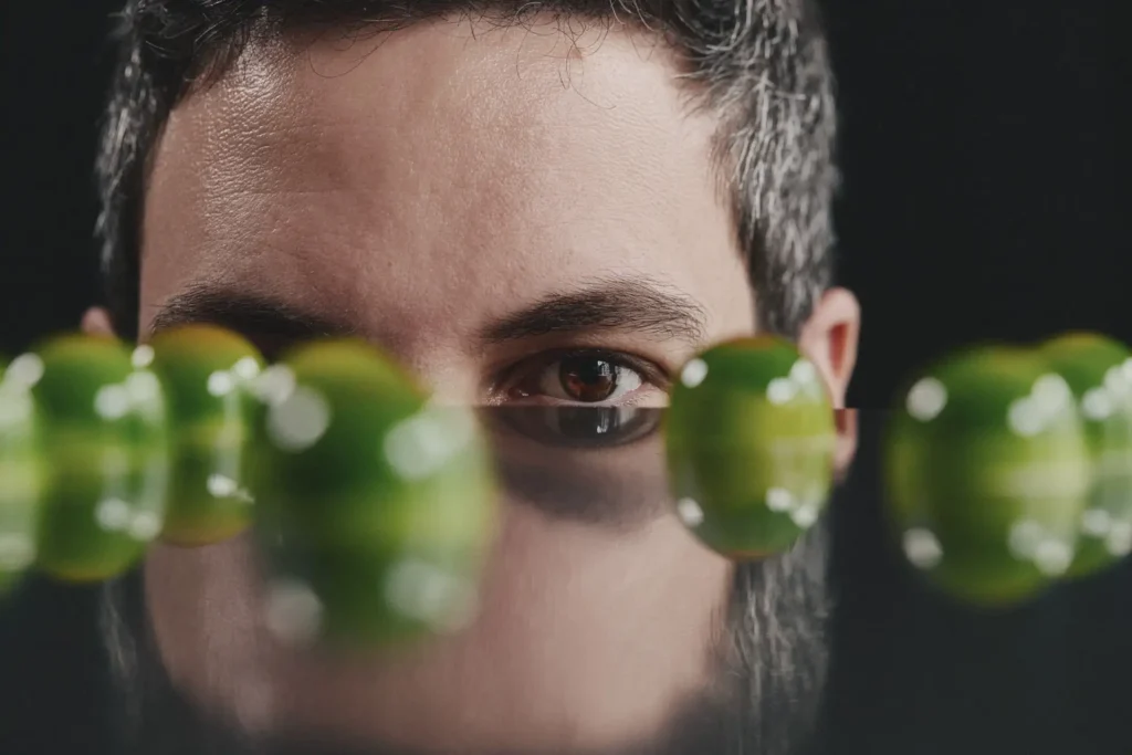 Creative pastry chef portrait with PRALINZ bonbons in foreground