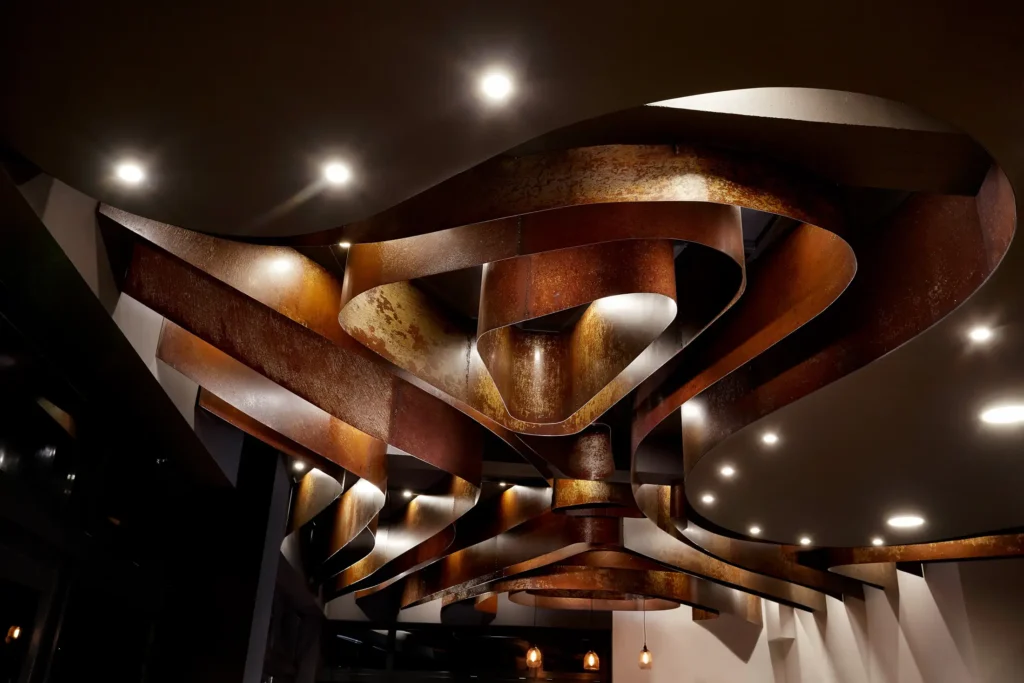 Rusted metallic ceiling detail at Efzymon bakery