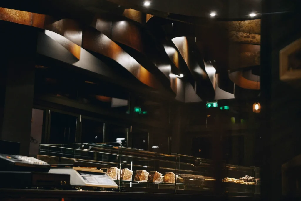 Efzymon bakery interior with displays and sculptural ceiling