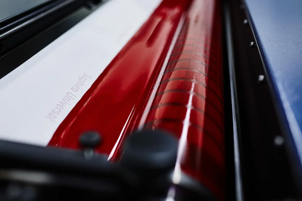 Heidelberg Speedmaster ink system detail with a red roller