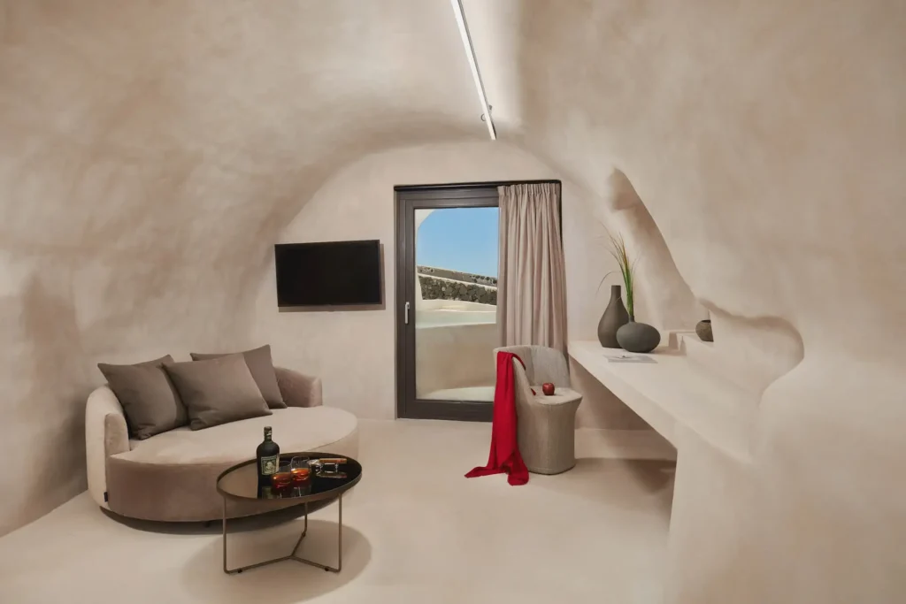 Divine Cave Santorini guest room interior with open sky view