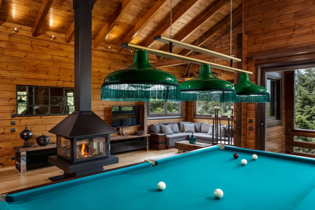 Wide chalet living room with billiard table in the foreground
