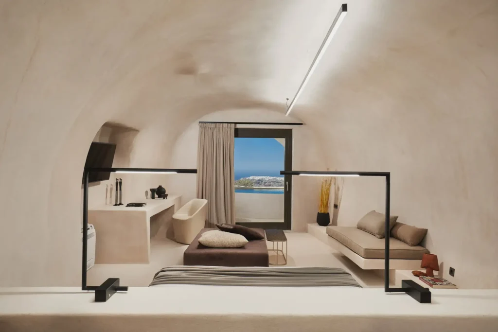 Divine Cave Santorini room interior overlooking the Oia landscape