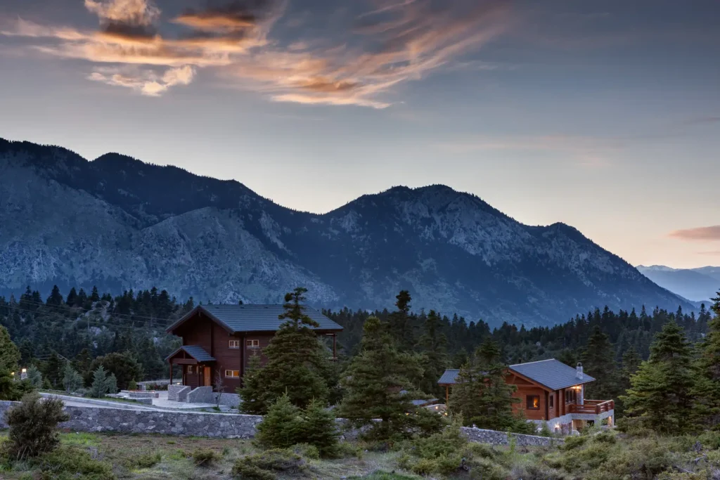 Exterior view of residential chalets in the mountain landscape of Mount Parnassos