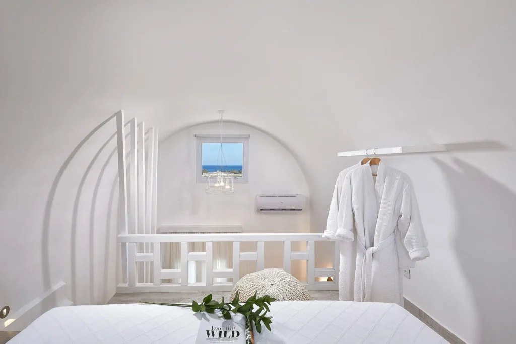 Upper-floor arched bedroom at Petri Suites in Santorini