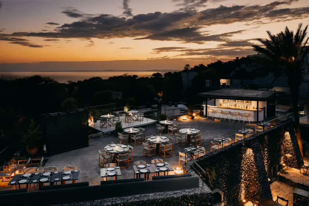 Alati Restaurant terrace overlooking Santorini vineyards at sunset