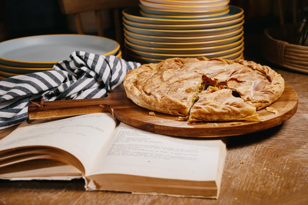 Traditional pie with old recipe book at Byzantium Restaurant London