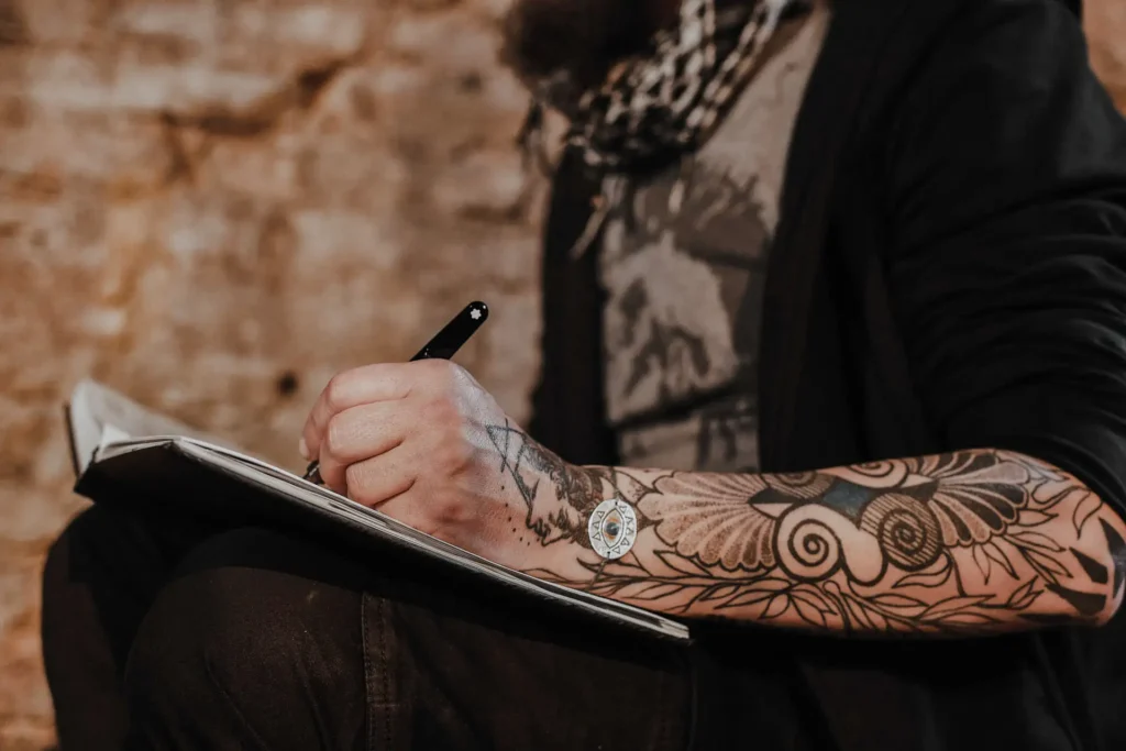 Close-up detail of Yannis Manikis chef tattoo