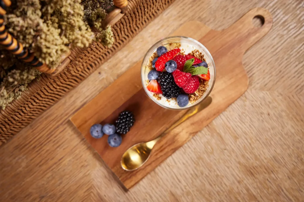 Granola breakfast bowl with berries at Byzantium Restaurant London