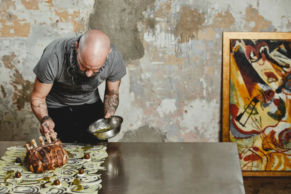 Contemporary plated dish on stainless steel in an industrial setting